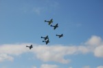 Six fighter aircraft adorn the sky